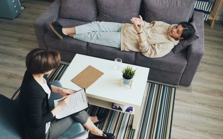 Therapist and teenager in a trauma-informed counseling session